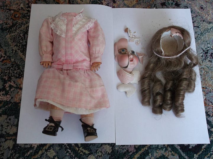 Damaged doll. Broken porcelain head. Broken pieces.