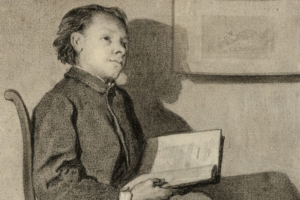 A young boy, day dreaming while holding a book he is in the middle of reading.