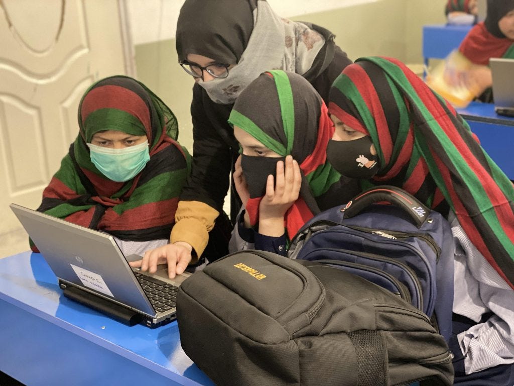 Afghan girls studying together. 
