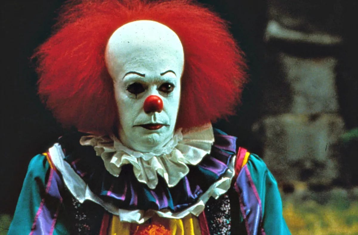 Tim Curry as Pennywise the dancing clown in 1990s IT.