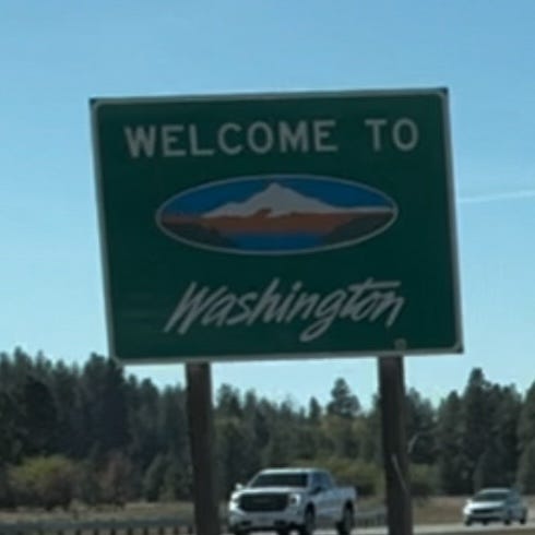 State-line signs for Washington from 2015 and 2023