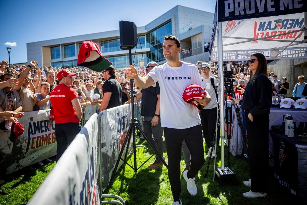 Charlie Kirk hands out hats before speaking at Utah Valley University in Orem, Utah, on Wednesday. Charlie Kirk hands out hats before speaking at Utah Valley University in Orem, Utah, on Wednesday.