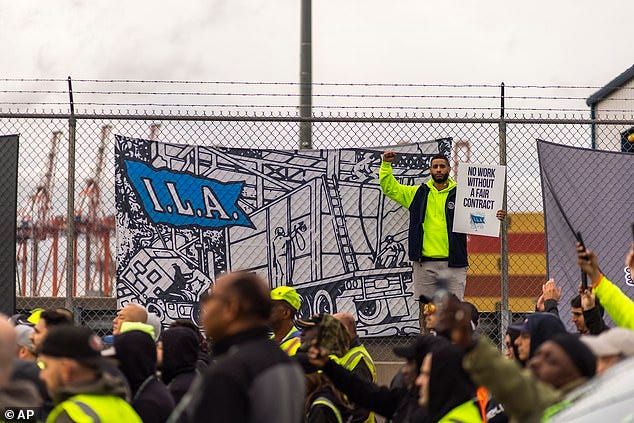 Workers take part in a port strike at Port Newark, Tuesday, in Bayonne, New Jersey. Workers take part in a port strike at Port Newark, Tuesday, in Bayonne, New Jersey.