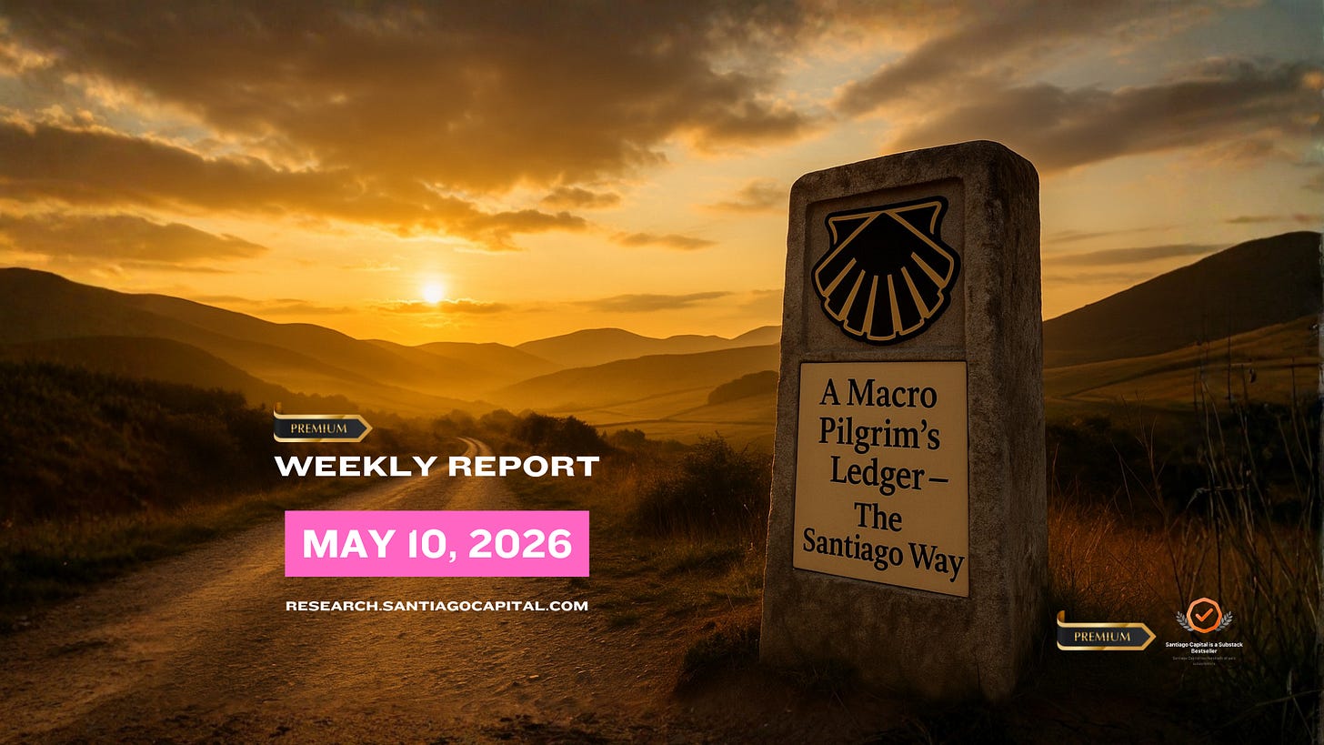 Stone pilgrimage marker on Santiago Way trail during golden sunset over mountains