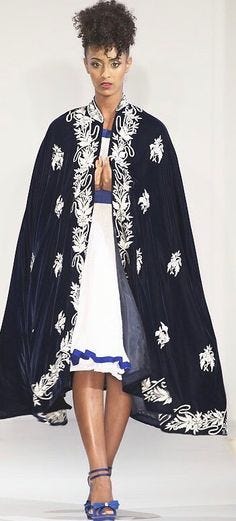 Farida Designs by Farida Deglel : Erithea. Zirzir (strips of fine handwoven cotton) 1950’s inspired dress with a dark blue fine silk velvet Kaba and silver embroidery.
