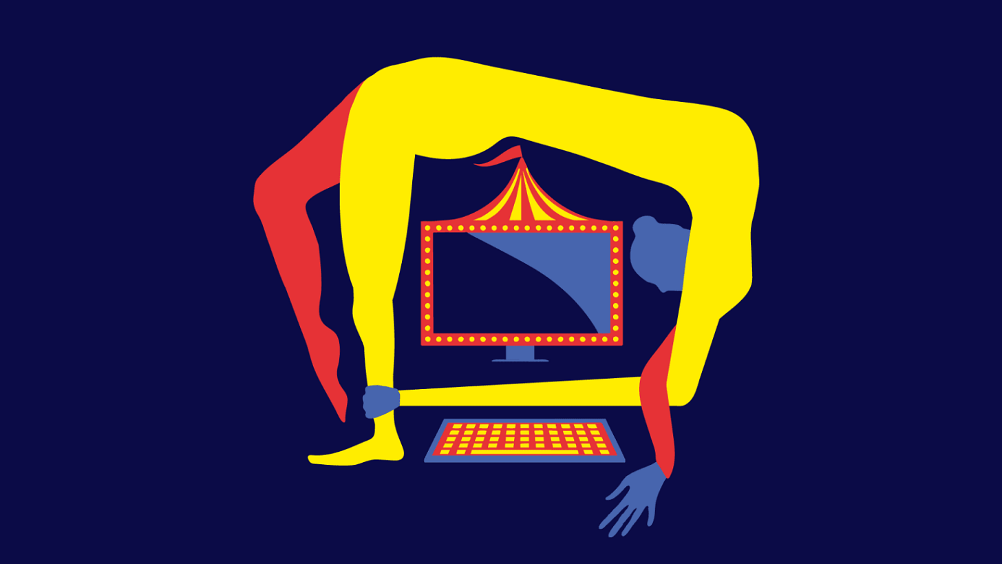 A circus performer leaning over a computer
