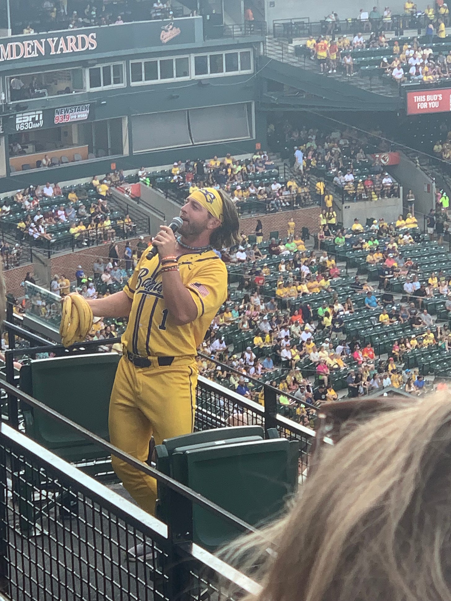 A Savannah Bananas player holds bananas that he threw down his teammate's pants