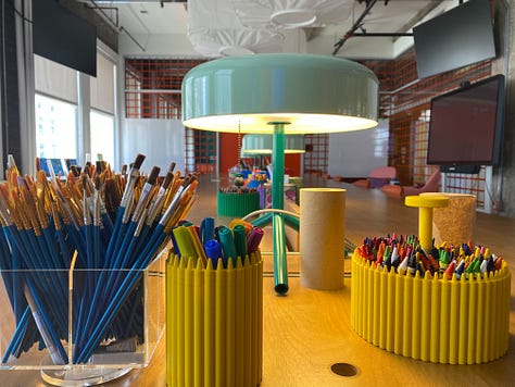 A Makerspace with creative tools like makers, paint, and crayons