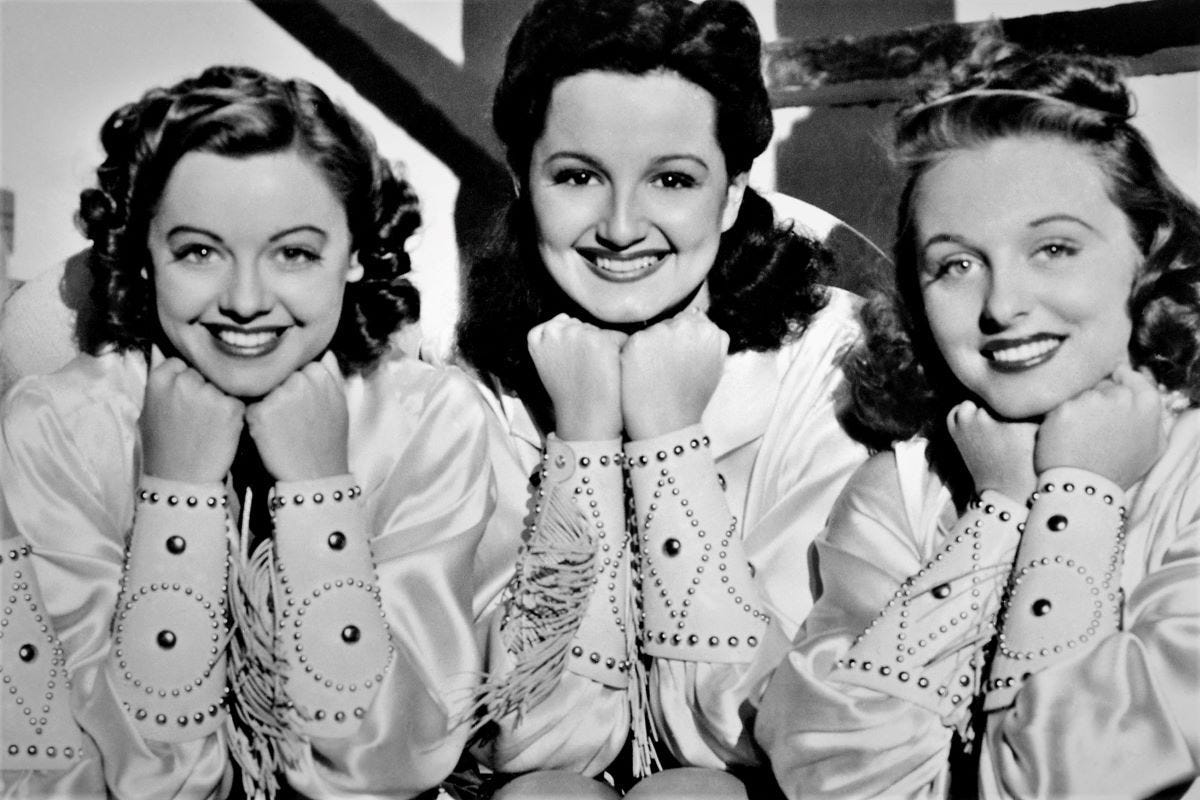 Three beautiful young women with 1940s styled hair Three beautiful young women with 1940s styled hair