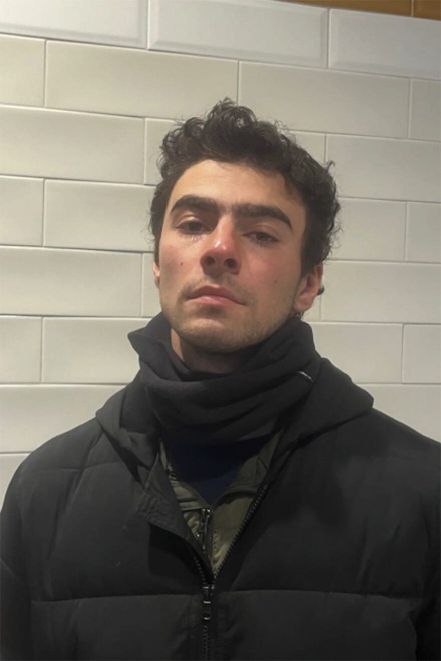 This photo provided by Pennsylvania State Police shows Luigi Mangione, a suspect in the fatal shooting of UnitedHealthcare CEO Brian Thompson, at the police station in Altoona, Pa., on Monday, Dec. 9, 2024. (Pennsylvania State Police via AP)