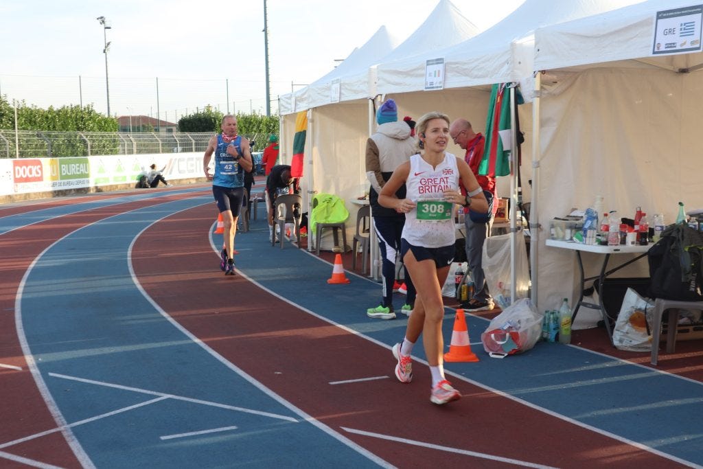 A person running on a track

AI-generated content may be incorrect.