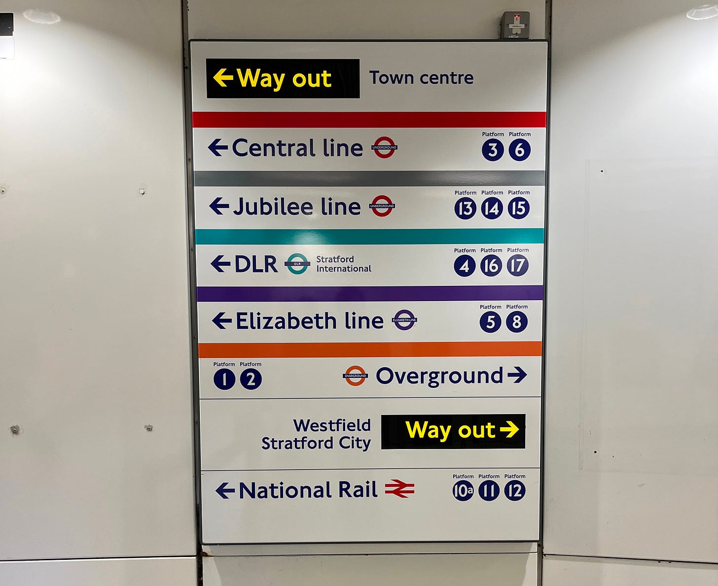 Photo showing wayfinding for various tube lines and additional modes at Stratford.