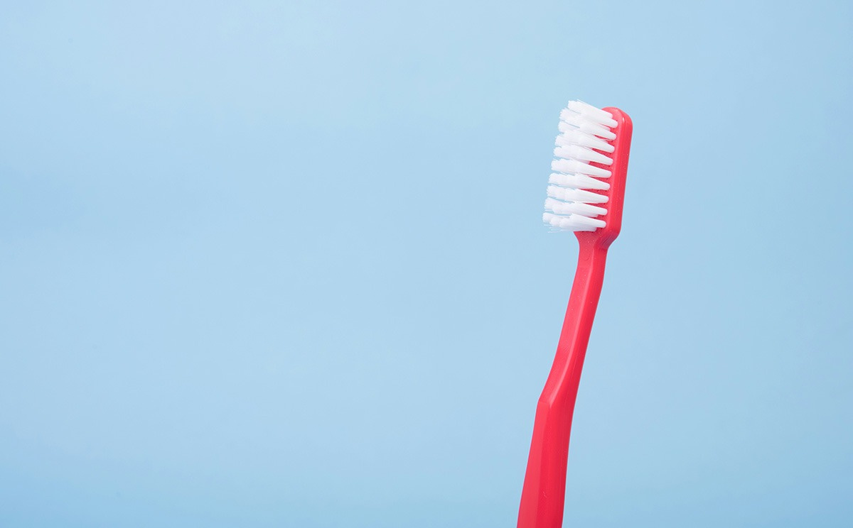 A toothbrush on a plain background