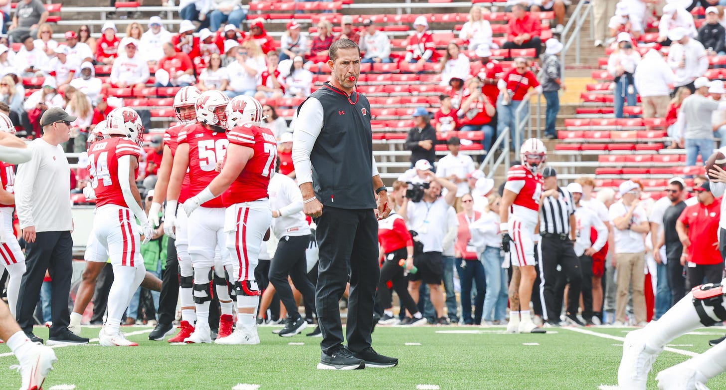 Wisconsin Badgers head coach Luke Fickell watches his team warm up before a game at Camp Randall Stadium Wisconsin Badgers head coach Luke Fickell watches his team warm up before a game at Camp Randall Stadium