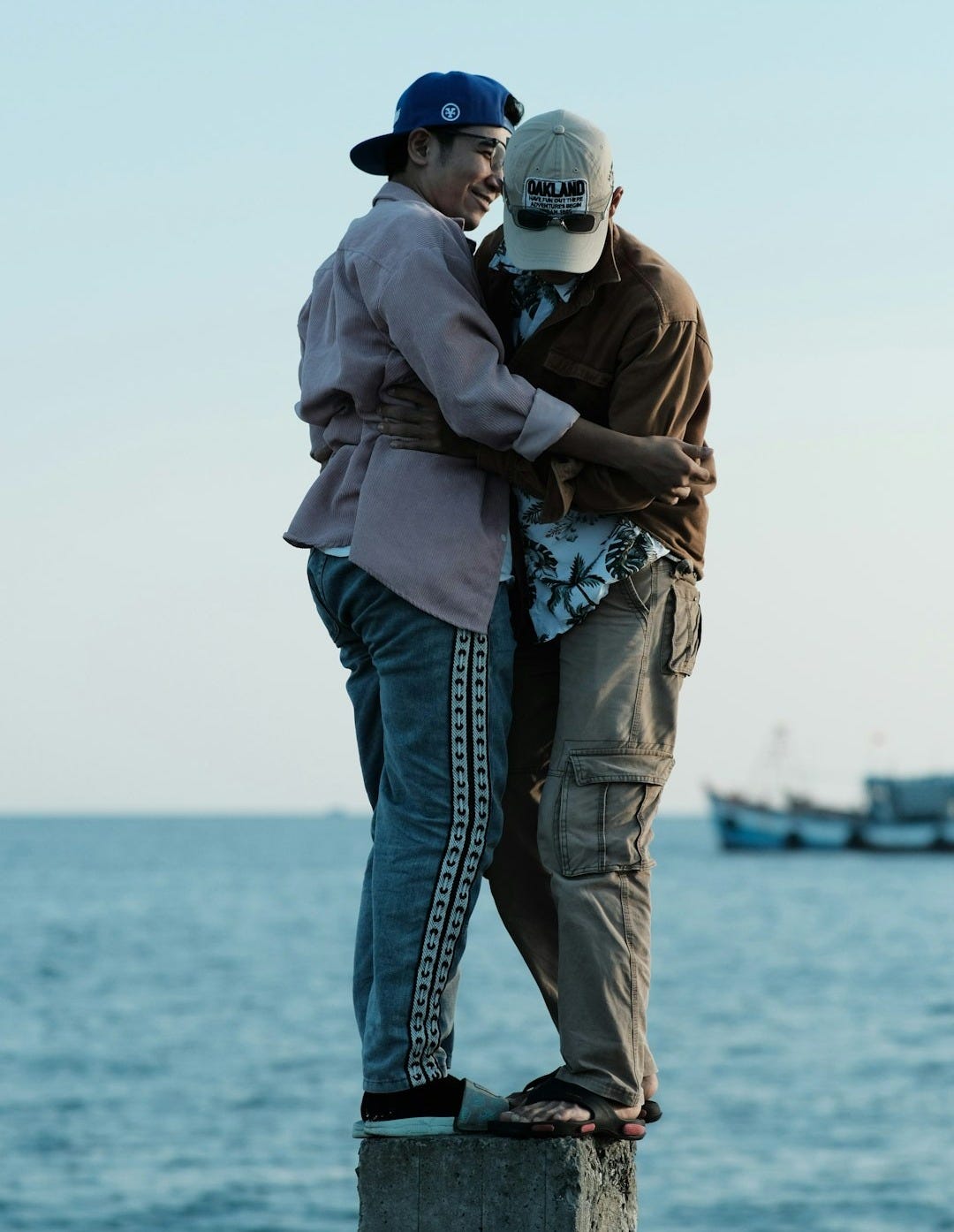 a couple of people that are hugging each other a couple of people that are hugging each other