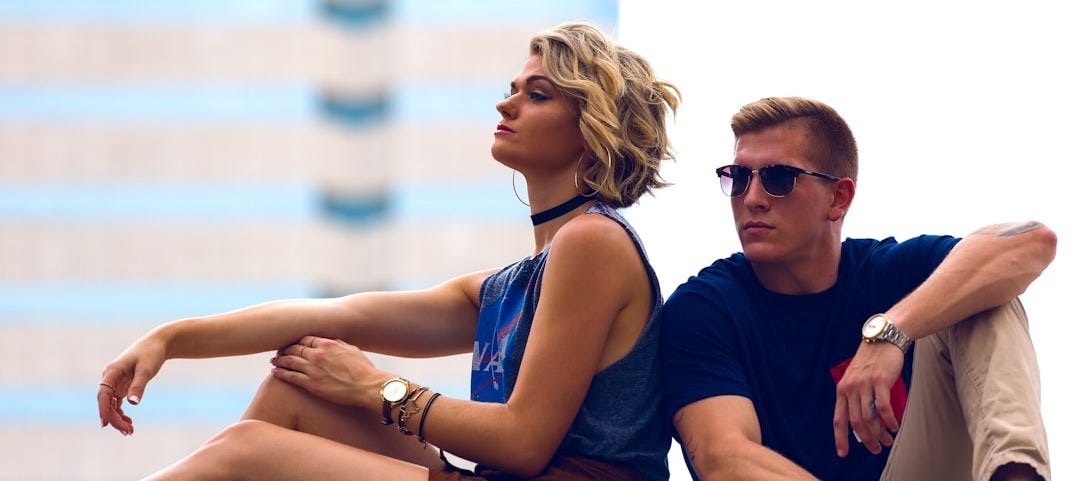 man and woman sitting posing for photo