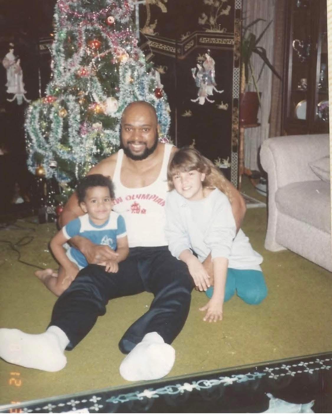 May be an image of child and christmas tree