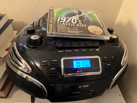 Music albums and CDs, stereo and boombox, and Simon and Garfunkel, the Who, Fleetwood Mac, and BB King