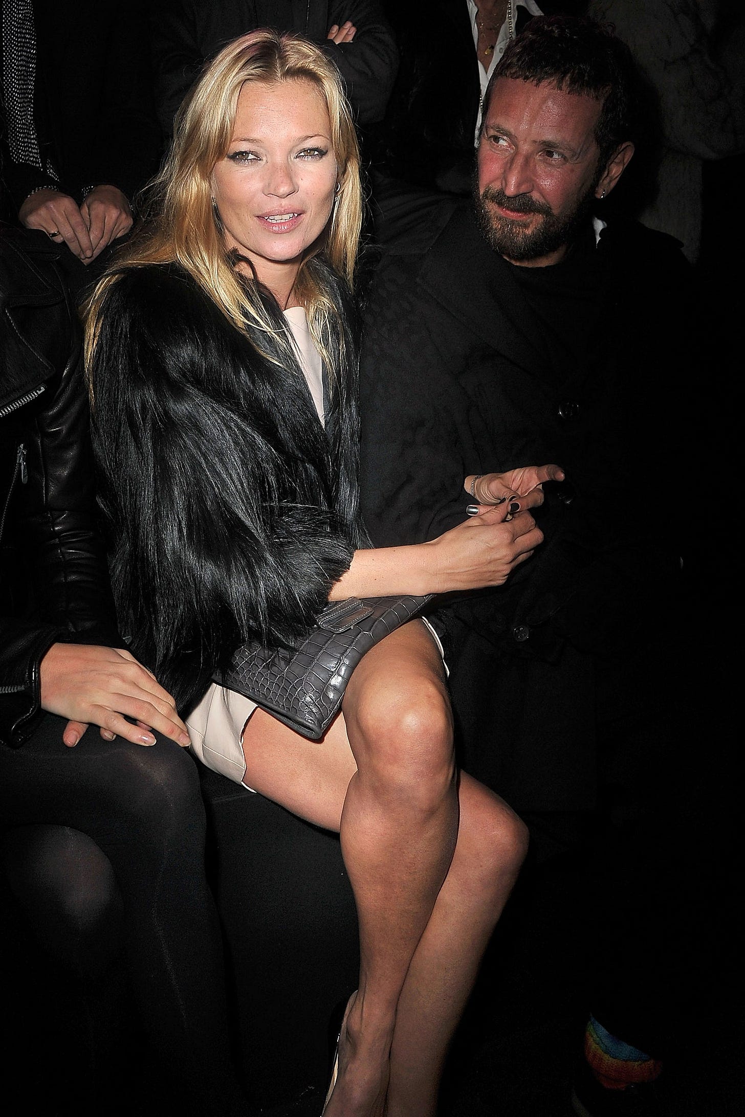 Image may contain Kate Moss Harland Williams Clothing Coat Jacket Adult Person Footwear High Heel Shoe and Baby