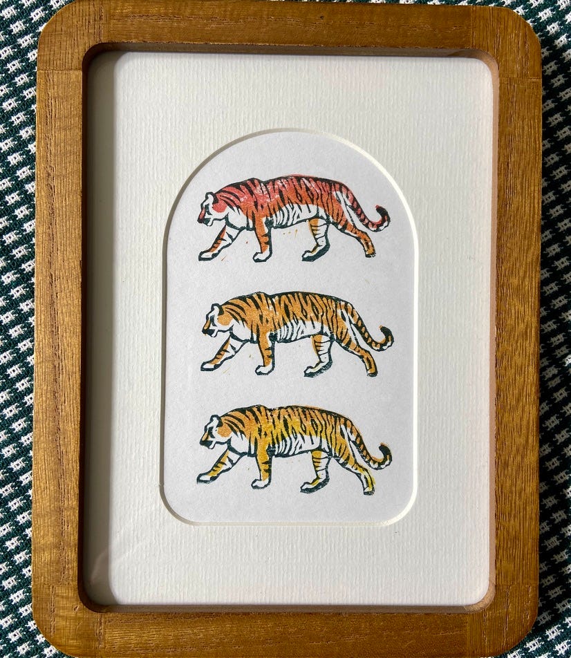 Framed print of 3 stamped tigers in an ombre of colors from orange to yellow