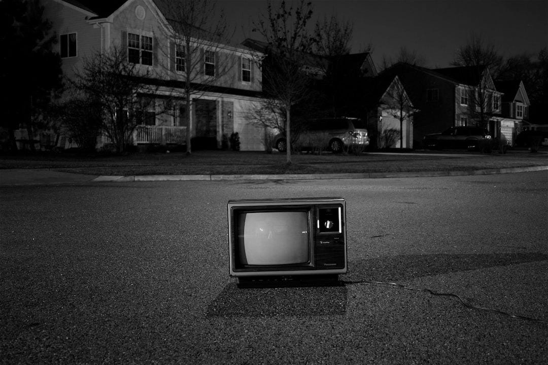turned off vintage CRT television on road
