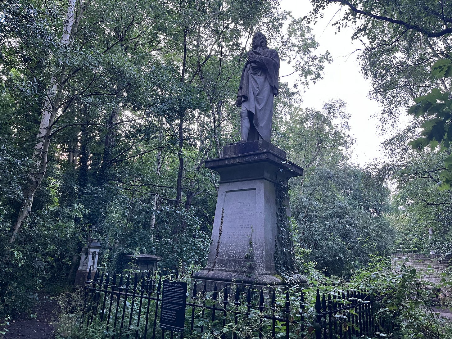 A large statue of Isaac Watts amidst a forested cemetery A large statue of Isaac Watts amidst a forested cemetery