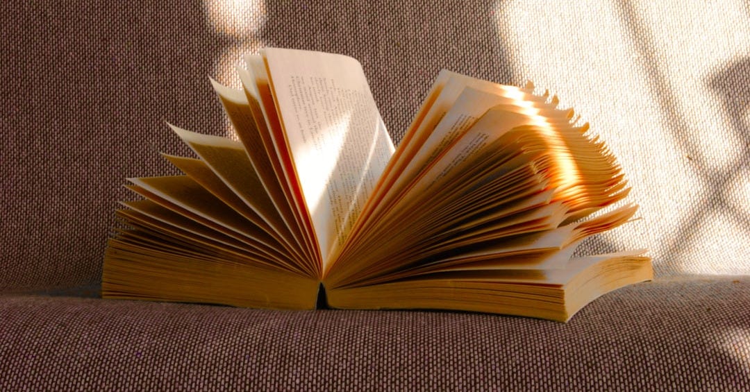 An open book lies on a soft surface. An open book lies on a soft surface.