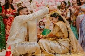 bride and groom during talambralu ritual bride and groom during talambralu ritual