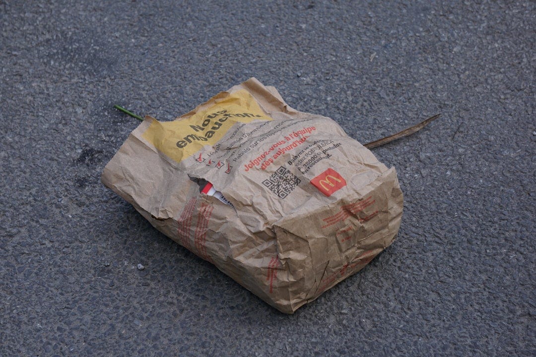 a piece of paper that is on the ground