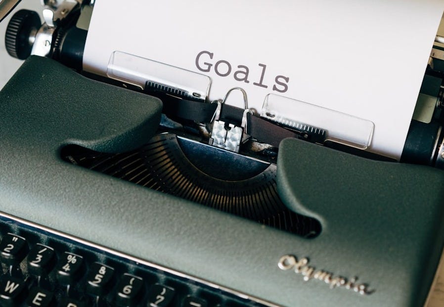 black and white typewriter on green textile