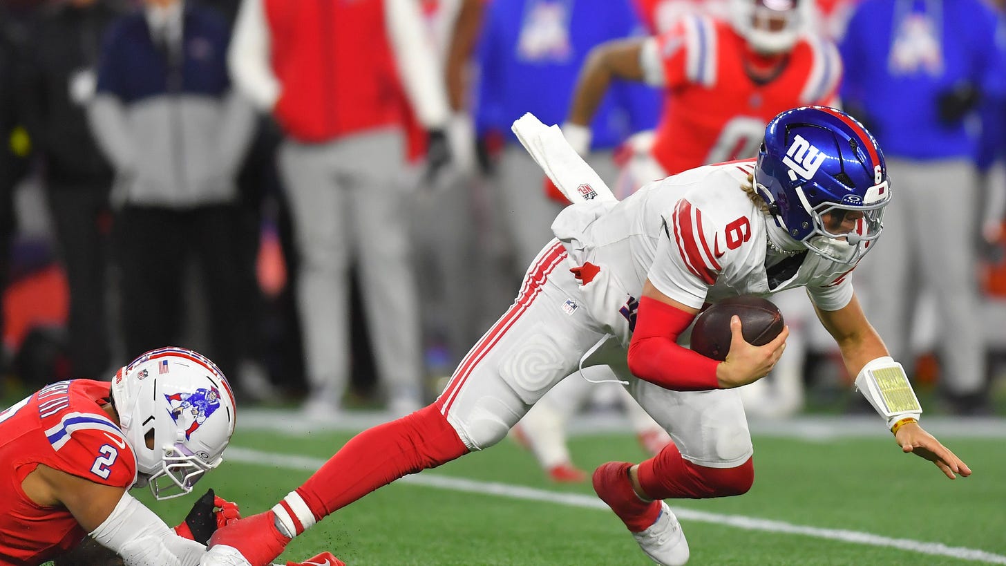 New York Giants quarterback Jaxson Dart (6) is sacked by New England Patriots linebacker Harold Landry III (2) during the second half of an NFL football game Monday, Dec. 1, 2025, in Foxborough, Mass. (AP Photo/Steven Senne)