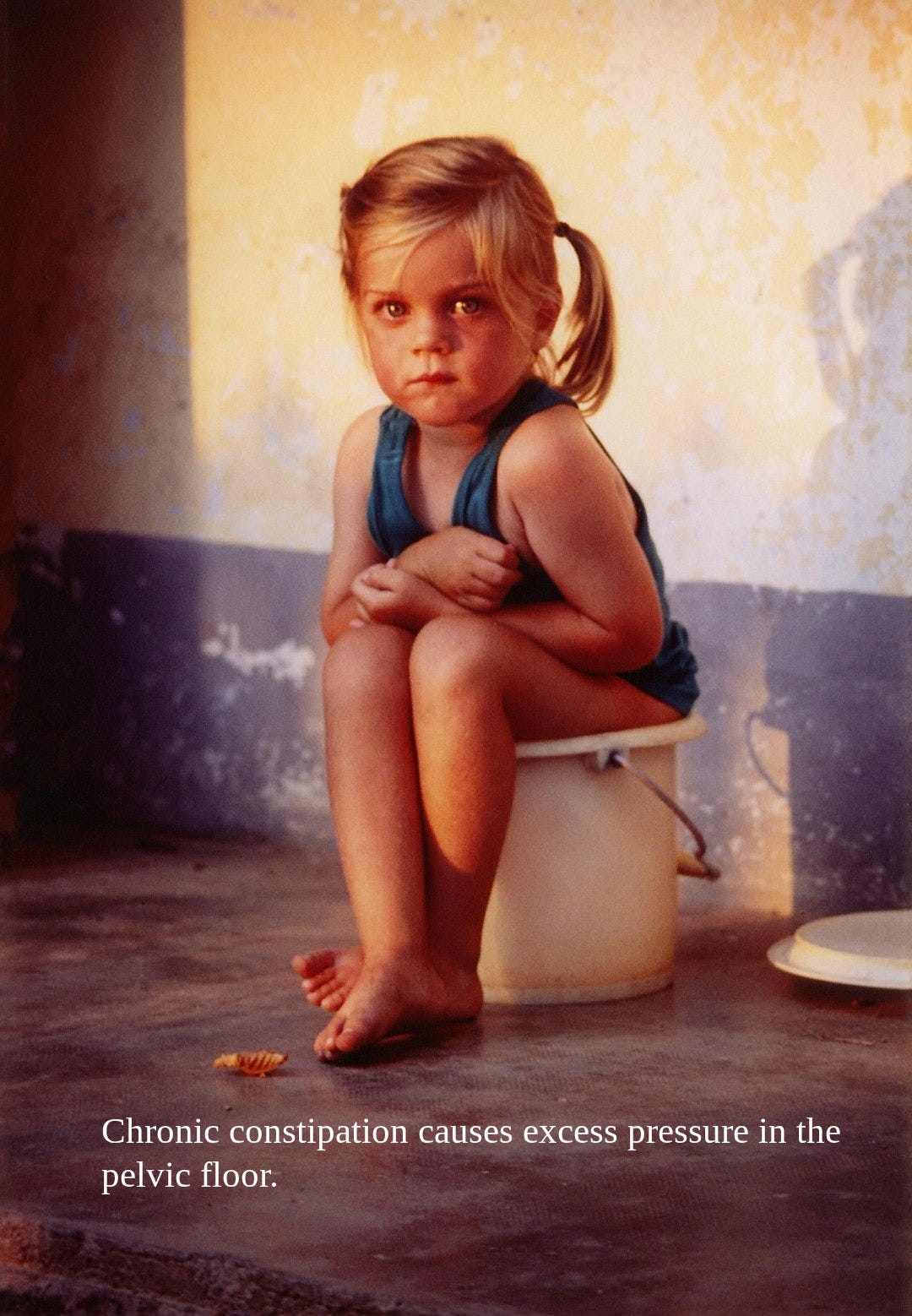 woman in blue tank top sitting on white ceramic toilet bowl woman in blue tank top sitting on white ceramic toilet bowl