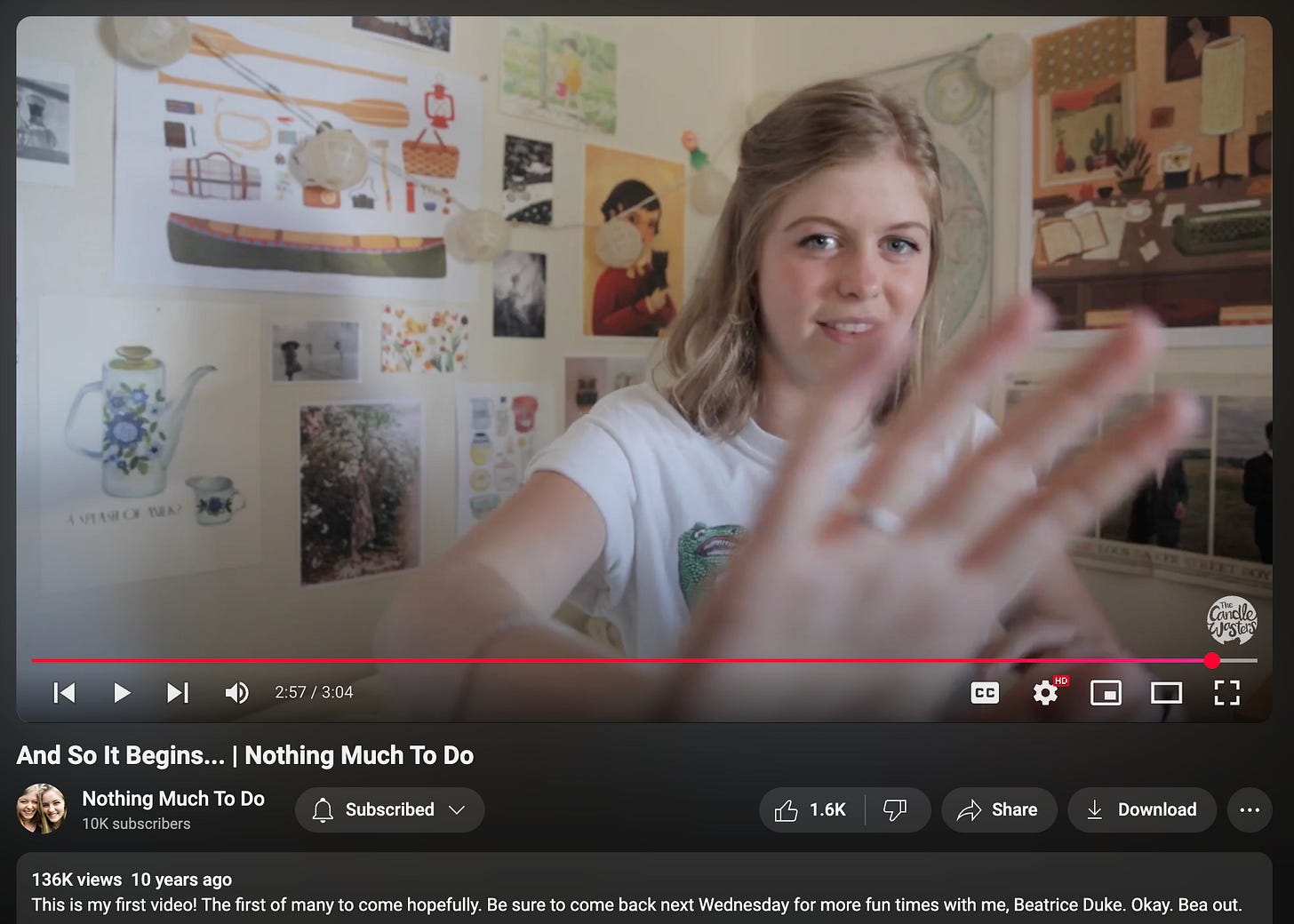 A YouTube video of Nothing Much To Do is paused partway through the episode, on a shot of Beatrice Duke (Harriett Maire) waving her hand in front of the camera.