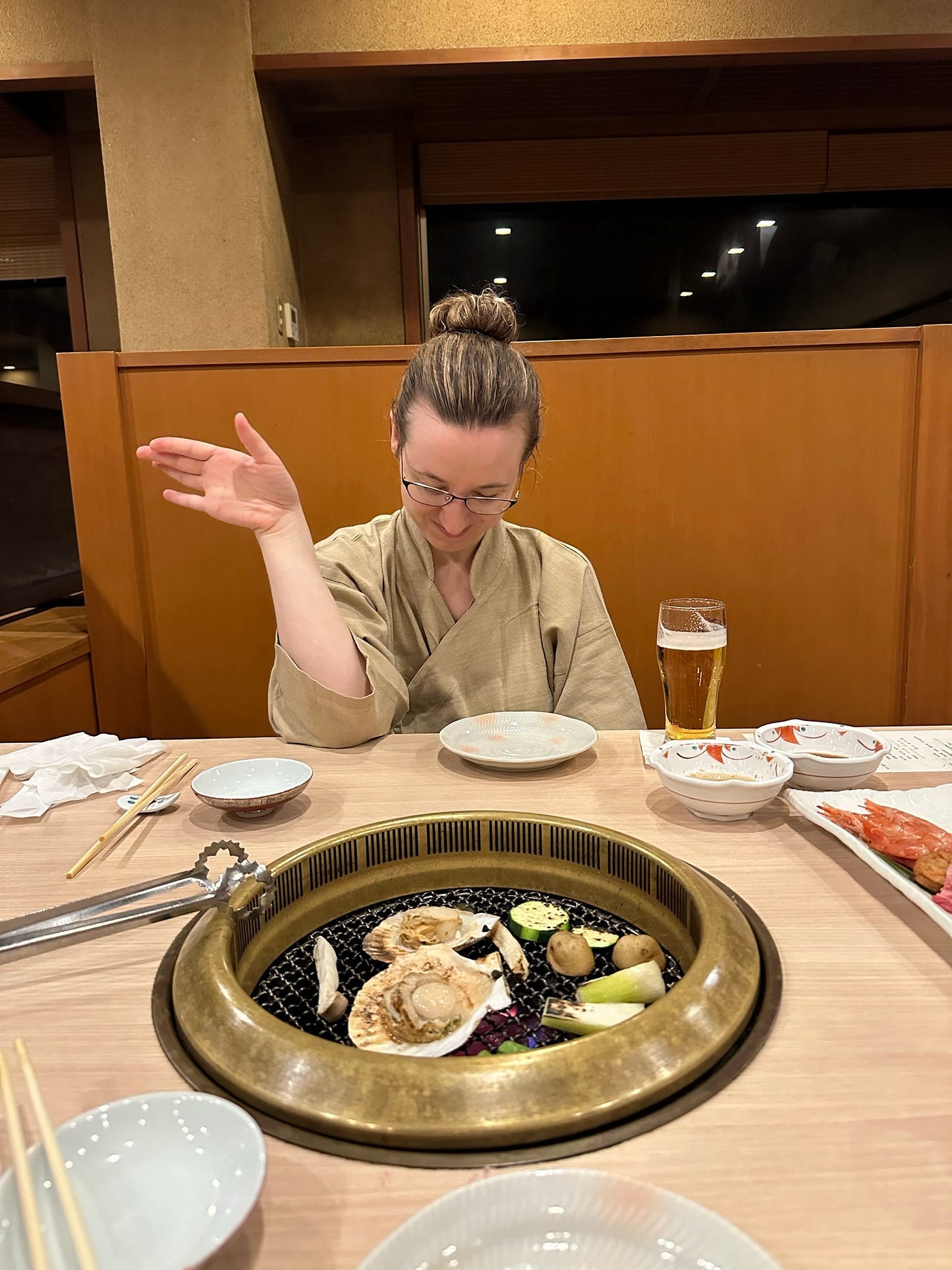 Mari-Alina Timoshchuk at a Japanese table enjoying dinner