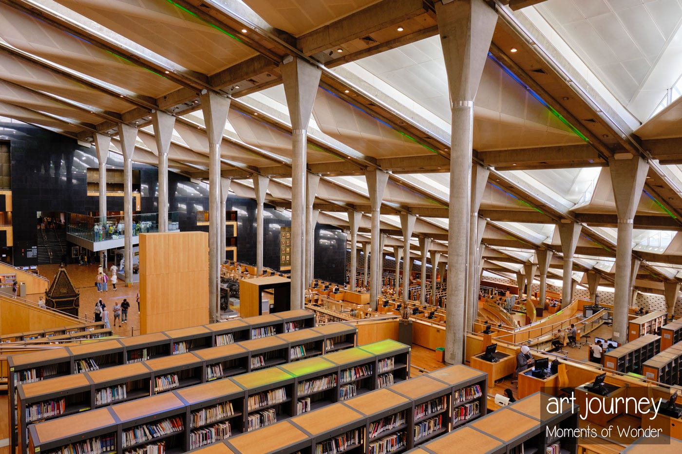 Inside the new Alexandria Library, wandering around the bookshelves in search of answers. Inside the new Alexandria Library, wandering around the bookshelves in search of answers.