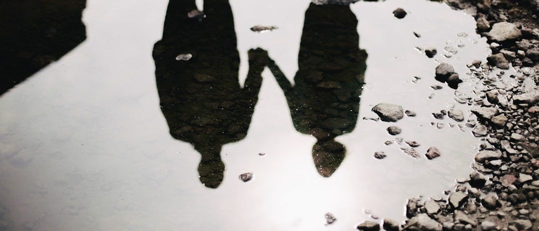 man and woman holding hand together man and woman holding hand together