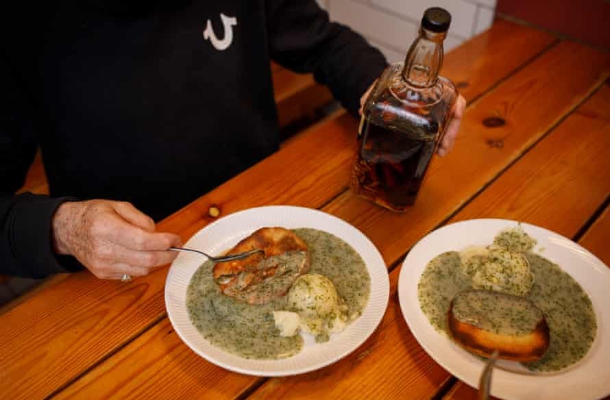 a man with a plate of pie and mash with chilli vinegar a man with a plate of pie and mash with chilli vinegar