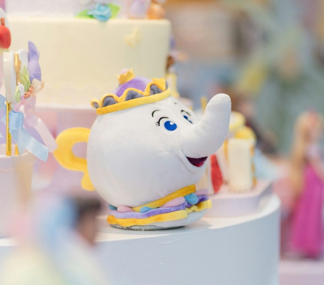 A chip figurine sits near a decorated cake.