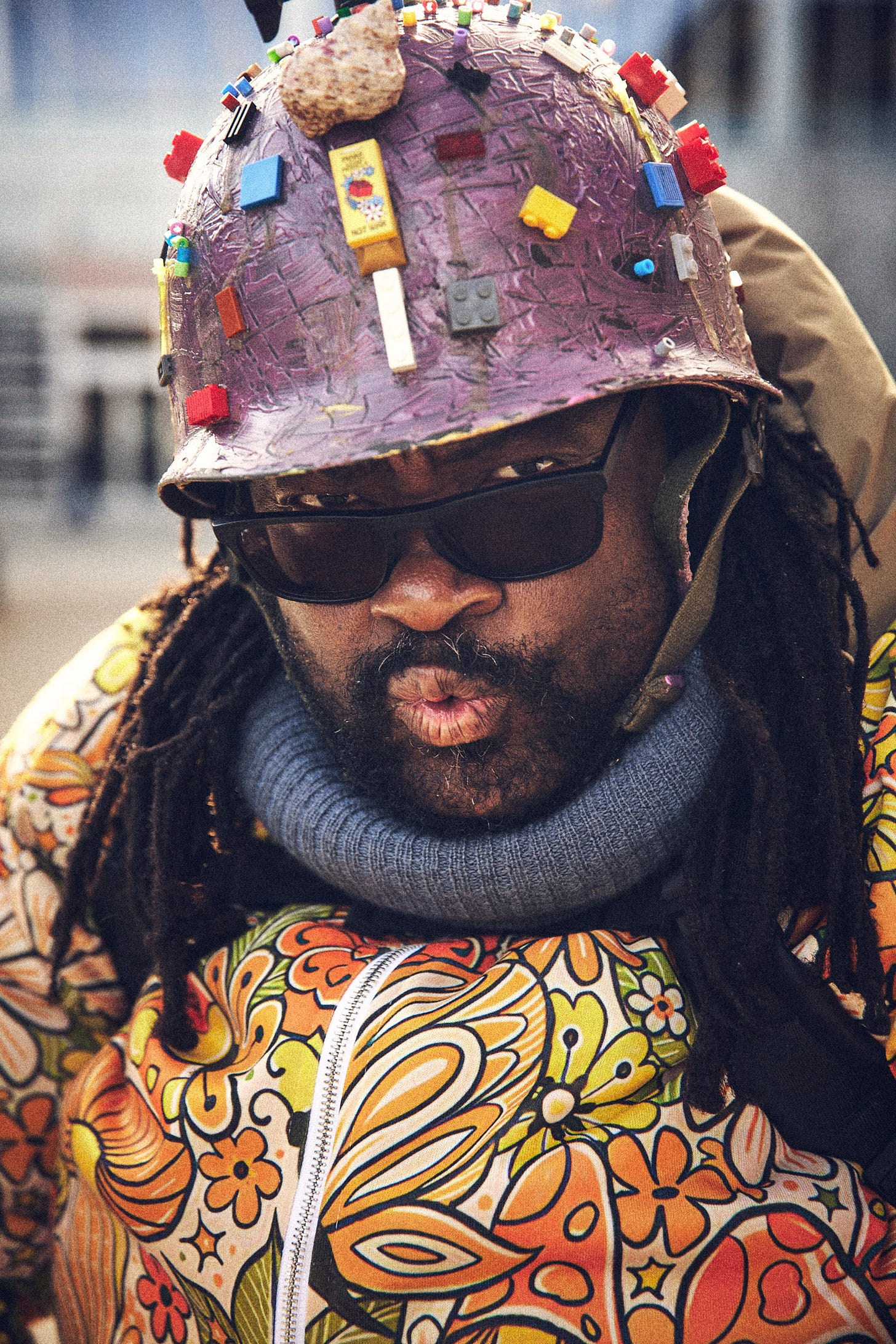 FatbikeHero is Performance Art Floral Costume wearing Painted Military Helmet with Lego. FatbikeHero is Performance Art Floral Costume wearing Painted Military Helmet with Lego.