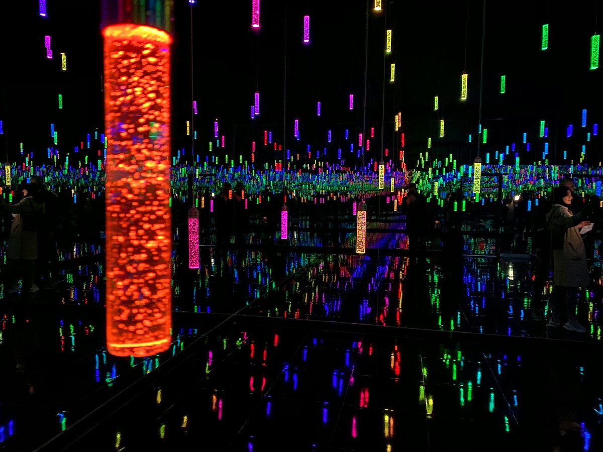 Infinity mirror lighting in a dark room with neon lights. Infinity mirror lighting in a dark room with neon lights.