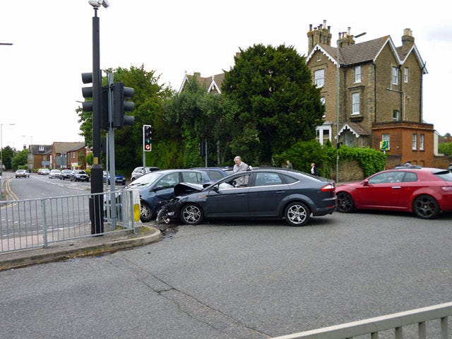 a road traffic condition with three vehicles at a traffic light a road traffic condition with three vehicles at a traffic light