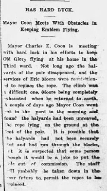 Narrow black-and-white newspaper clipping from the Port Townsend Leader headed “HAS HARD LUCK,” with the subheading “Mayor Coon Meets With Obstacles in Keeping Emblem Flying.” The May 3, 1917 article describes Mayor Charles E. Coon’s difficulty keeping an American flag flying at his home.