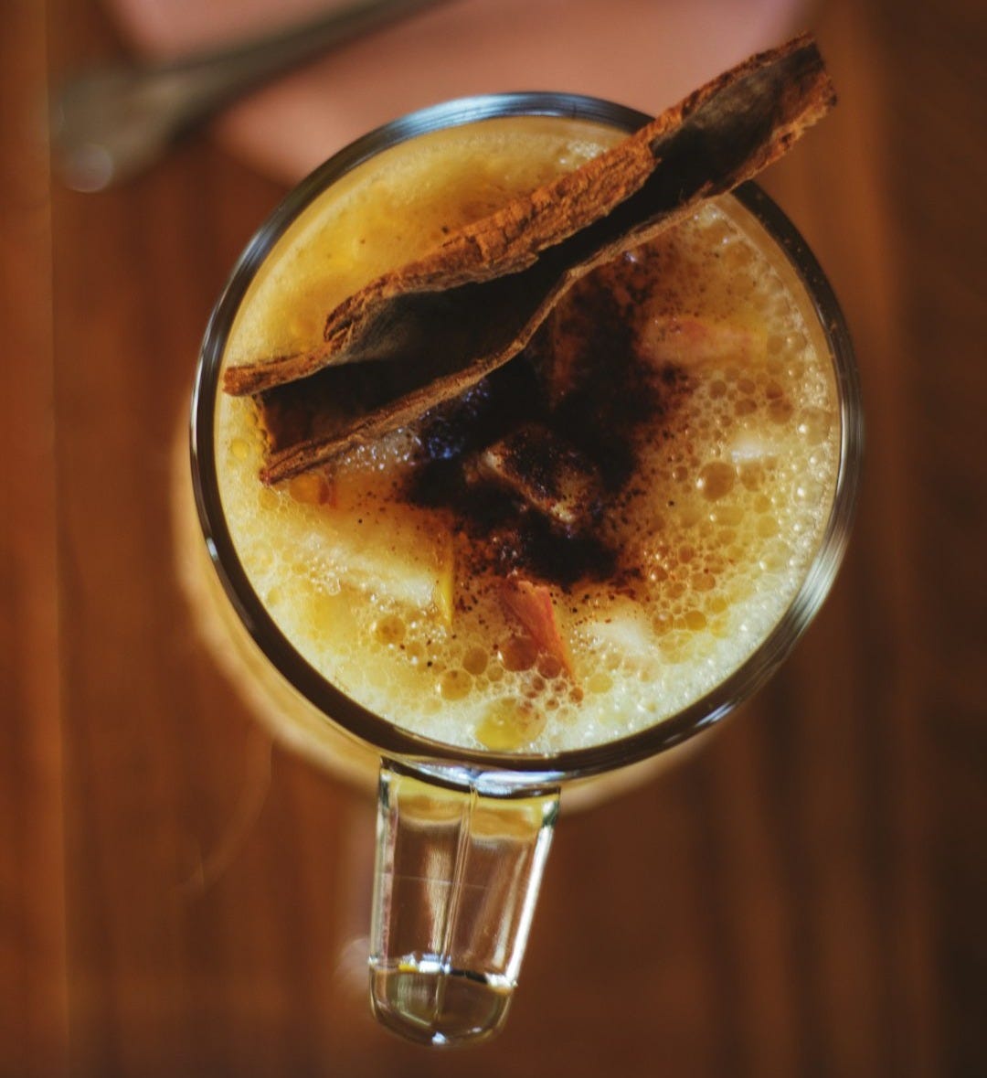 clear drinking glass with brown liquid