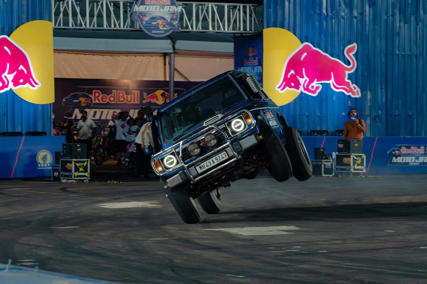 A stunt car about to flip over