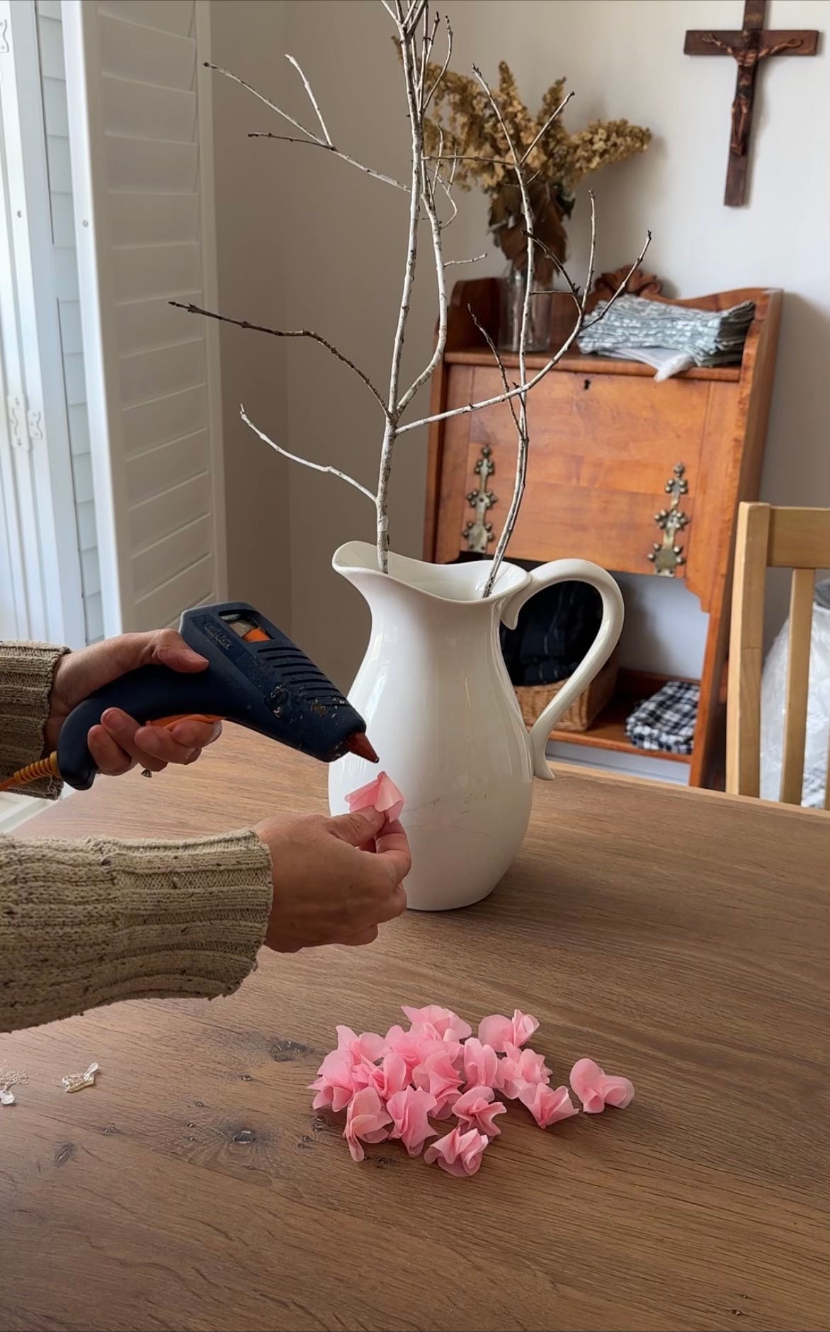 hot gluing blossoms to branch