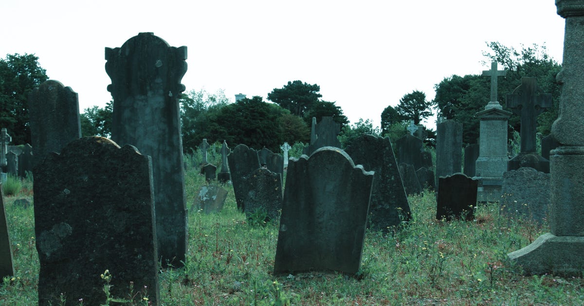An old graveyard with a variety of gravestones in different shapes and sizes