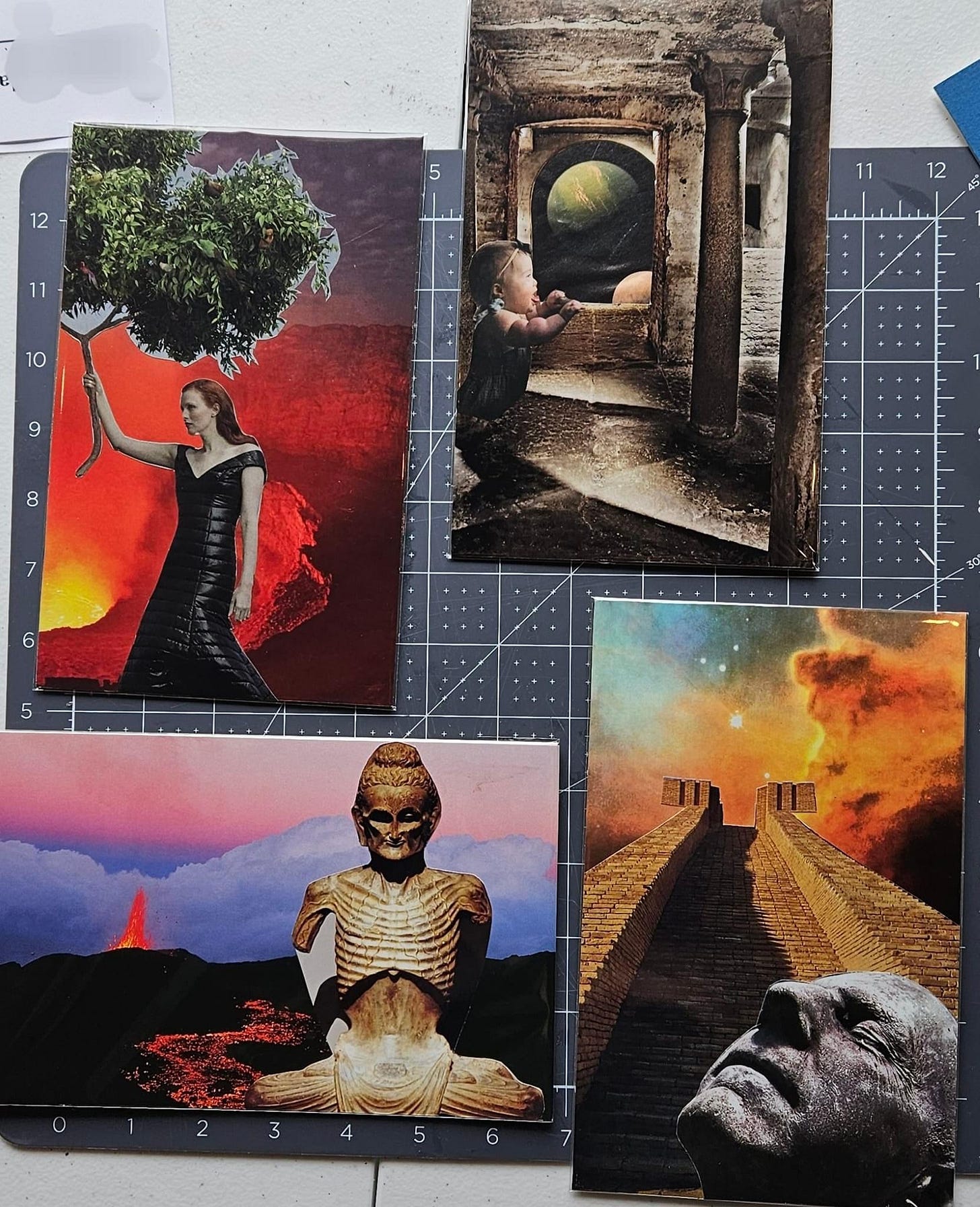 Four sets of collage art cards on a cutting board.