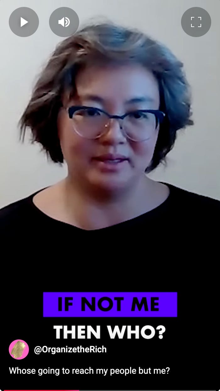 A screenshot photo of Sharon from the video clip. She is wearing a black top and has silver, black shoulder length hair. The text at the bottom says "If not me, then who?"