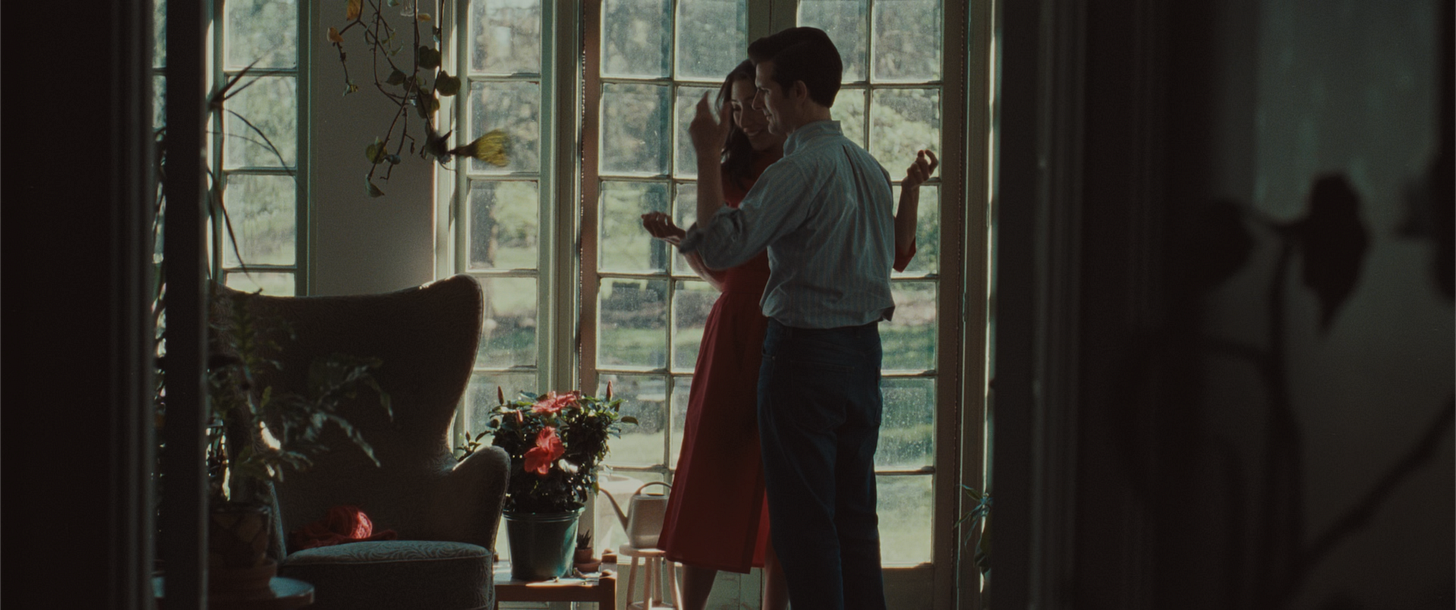 Mark and Gemma dancing together in the flashback scene