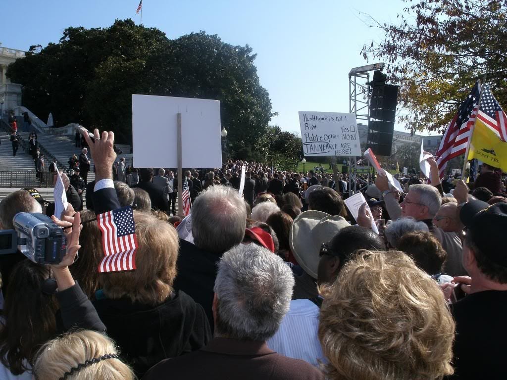 It may be difficult to see in the center of the picture, but the neatly-arranged rows of well-dressed people were the House's Republican caucus. It may be difficult to see in the center of the picture, but the neatly-arranged rows of well-dressed people were the House's Republican caucus.